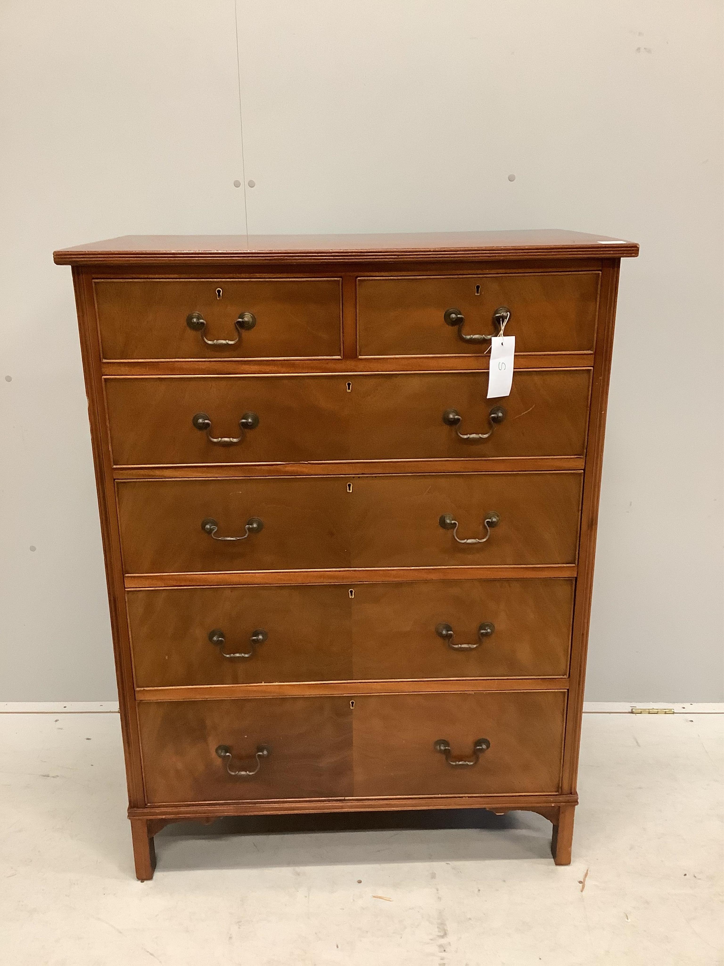 A George III style mahogany chest of two short and four long drawers, veneered fronts with brass loop handles, on bracket feet, width 91cm, depth 52cm, height 122cm. Condition - fair